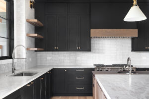 View of elegant dark cabinetry on a remodeling modern kitchen