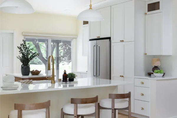 Bright kitchen remodel in Fort Collins, CO with warm wood island and quartz countertops
