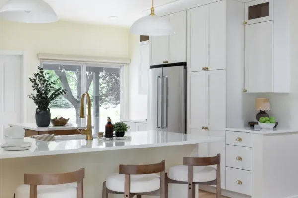 Bright kitchen remodel in Fort Collins, CO with warm wood island and quartz countertops